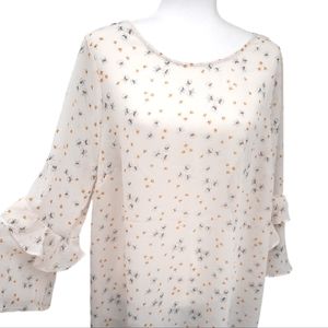 Torrid cream tunic criss-cross back with mustard colored flowers size 2